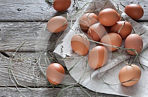 Fresh chicken brown eggs on rustic wood, organic farming concept