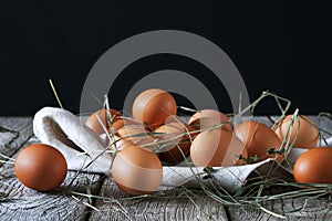 Fresh chicken brown eggs on rustic wood, organic farming concept