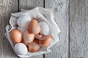 Fresh chicken brown eggs on rustic wood, organic farming concept