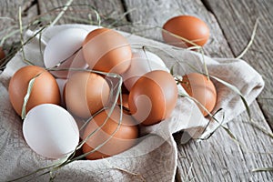 Fresh chicken brown eggs on rustic wood, organic farming concept