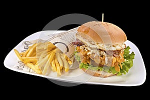 Fresh chicken burger with crispy french fries, on a white plate