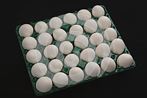 fresh chicken eggs in a plastic container. egg. murgi ke andai. koli muttai. raw eggs. photo