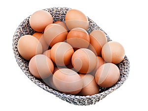 Fresh chicken eggs in wicker basket