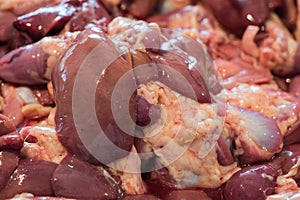 Fresh chicken entrails on display in a meat market