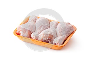 Fresh chicken legs on the retail tray