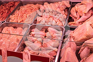 Fresh chicken meat in a supermarket. Raw meat at butcher shop