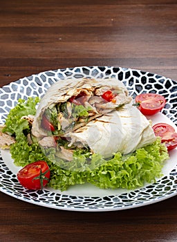 Fresh chicken roll with fresh tomatos, salad, cheese and onions. Shaurma, shawerma, fajita