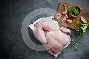 Fresh chicken with spices on vintage background
