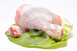 Fresh chicken thighs on white background