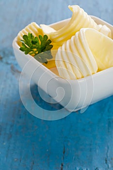 Fresh chilled butter curls in a small bowl