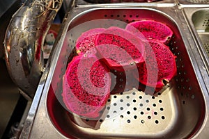 Fresh chinese red dragon fruit in market photo