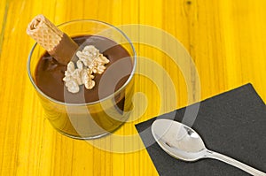 Fresh chocolate mousse with walnut and mint.