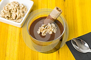 Fresh chocolate mousse with walnut and mint.