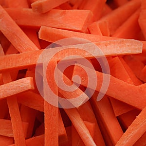 Fresh chopped carrots close-up background