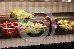 Fresh chopped fruits for picking up from buffet for hotel system of all-inclusive. Copy space