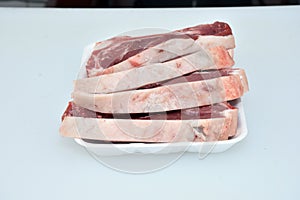 Fresh chopped slices of lamb meat in plate