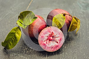 Fresh Chrysophyllum cainito fruits on wood background