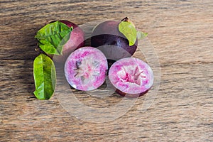 Fresh Chrysophyllum cainito fruits on wood background