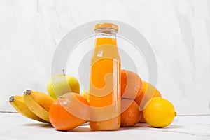 Fresh citrus fruit juice in glass bottle, tangerine juice