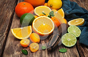 Fresh citrus fruits and old juicer
