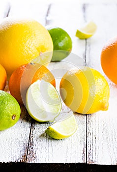 Fresh citrus fruits on white