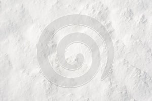 Fresh clean white snow background texture. Winter background with frozen snowflakes.