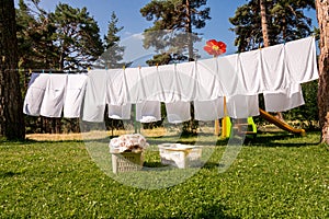 Fresh clean white towels drying on washing line
