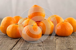 Fresh clementines on a wooden base