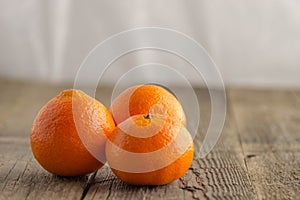 Fresh clementines on a wooden table