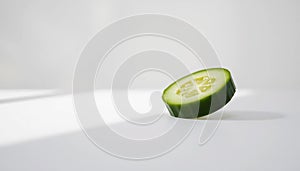 Single Green Cucumber Slice photo