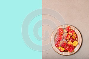 Fresh cloudberries prepared for food against the bag background