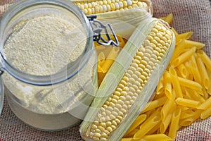 Fresh cob of corn and flour in a jar  in  gluten free pasta