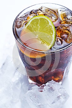 Fresh cocktail with cola drink and lime