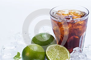 Fresh cocktail with cola drink and lime