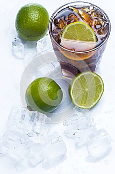 Fresh cocktail with cola drink and lime