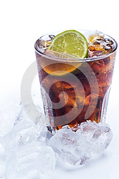 Fresh cocktail with cola drink and lime