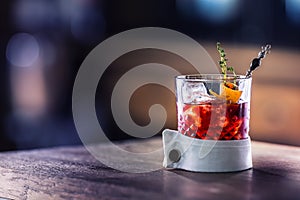 Fresh cocktail drink with ice fruit and herb decoration. Alcoholic, non-alcoholic drink-beverage at the bar counter in the pub.