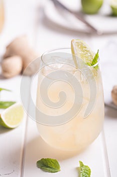 Fresh cocktail prepared with ginger beer, lime and ice