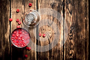 Fresh cocktail of wild raspberries in a shaker.