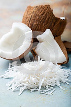 Fresh coconut flakes on a blue background