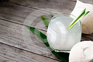 Fresh coconut juice in a glass with coconut white meat isolated on white