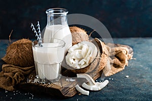 Fresh coconut milk in glass and bottle