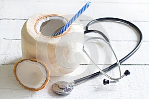 Fresh coconut milk medicine cocnept with stethoscope photo