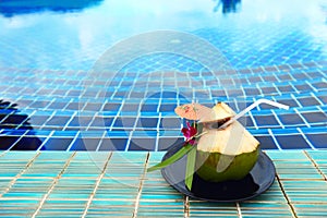 Fresh Coconut from tree ready to with straw, place nicely along Blue Pool