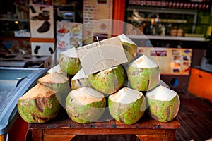 Fresh coconuts for sale on local market in Thailand
