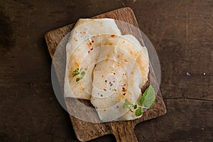 Fresh Cod Fillet on Wooden Board