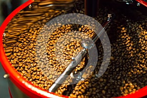 Fresh coffee beans being roasted in a store