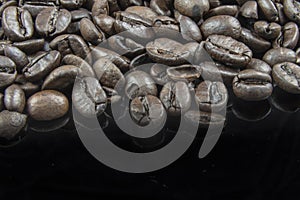 Fresh Coffee Beans Close Up with a Black Background