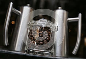 Fresh coffee beans in jars ready to grind and make a espresso or latte