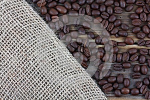 Fresh coffee beans on wood background